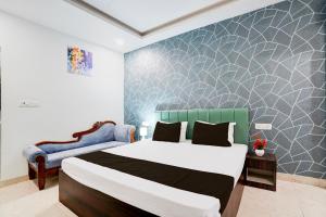 Postel nebo postele na pokoji v ubytování Hotel O Alankrita Resort