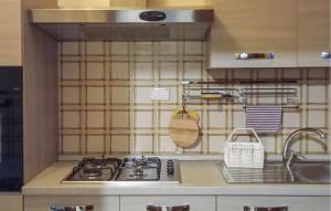 A kitchen or kitchenette at Cozy Apartment In Marina Di Santangelo
