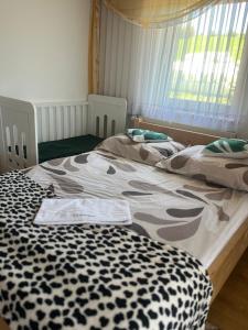 Postel nebo postele na pokoji v ubytování U kowalczyków
