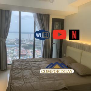En eller flere senge i et værelse på COMFORTSTAY-Pollux Mall Batam Center TOWER B #3902