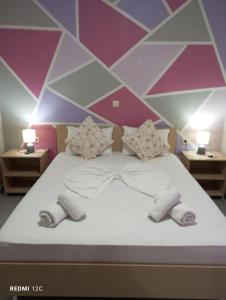 Postel nebo postele na pokoji v ubytování Sunray Apartments