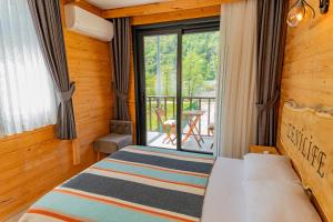 Postel nebo postele na pokoji v ubytování Zenilife Suit Apart & Bungalov