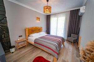 Postel nebo postele na pokoji v ubytování Zenilife Suit Apart & Bungalov