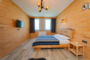 Postel nebo postele na pokoji v ubytování Zenilife Suit Apart & Bungalov