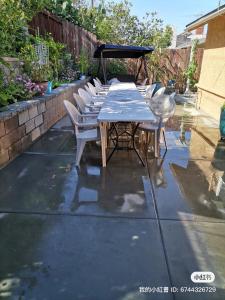 a table and chairs sitting on a patio at 1 bedroom In a quiet neighborhood near the Main Street- Room A in Rowland Heights +6 photos