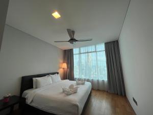 Ένα ή περισσότερα κρεβάτια σε δωμάτιο στο Vortex Residence KLCC Bukit Bintang Kuala Lumpur