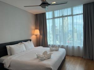 Ένα ή περισσότερα κρεβάτια σε δωμάτιο στο Vortex Residence KLCC Bukit Bintang Kuala Lumpur +37 φωτογραφίες