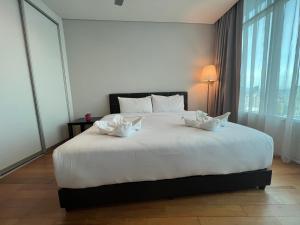 Ένα ή περισσότερα κρεβάτια σε δωμάτιο στο Vortex Residence KLCC Bukit Bintang Kuala Lumpur