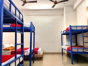 Naadi Hotel New Busstand Thanjavur客房内的一张或多张床位