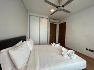 Ένα ή περισσότερα κρεβάτια σε δωμάτιο στο Vortex Residence KLCC Bukit Bintang Kuala Lumpur