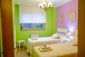 A bed or beds in a room at Apartamento Sella y Mar - VUT12AS