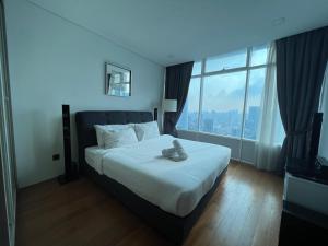 Ένα ή περισσότερα κρεβάτια σε δωμάτιο στο Vortex Residence KLCC Bukit Bintang Kuala Lumpur