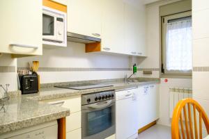 A kitchen or kitchenette at Apartamento Sella y Mar - VUT12AS