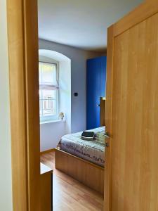 Postel nebo postele na pokoji v ubytování Casa nel centro di Cembra + 4 fotografie