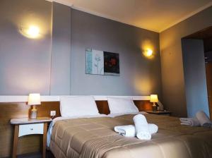 A bed or beds in a room at Marilena's house