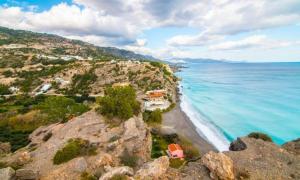 an aerial view of a beach and the ocean at Villa Joseph in Agia Fotia