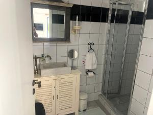 a bathroom with a sink and a shower at Villa Joseph in Agia Fotia +35 photos