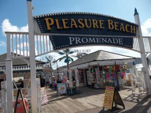 a boardwalk with a sign that reads pleasure beach pronounced at Chantry Villa Hotel in Skegness
