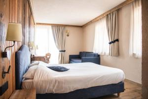Postel nebo postele na pokoji v ubytování Hotel La Montanina