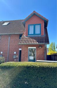 a red brick house with blue windows at 7034 Enseling in Dahme