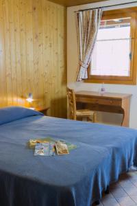 A bed or beds in a room at Agriturismo Pian dei Tass
