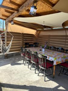a table and chairs sitting on a patio at Casa.Puf in Techirghiol