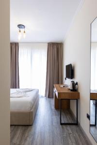 Postel nebo postele na pokoji v ubytování B Boutique Hotel