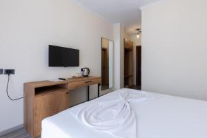TV a/nebo společenská místnost v ubytování B Boutique Hotel