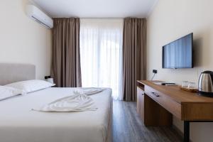 Postel nebo postele na pokoji v ubytování B Boutique Hotel