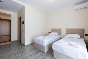 Postel nebo postele na pokoji v ubytování B Boutique Hotel