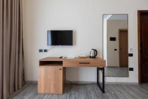TV a/nebo společenská místnost v ubytování B Boutique Hotel