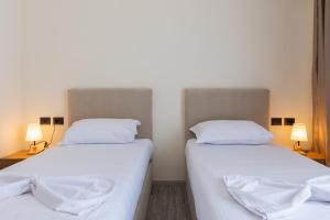 Postel nebo postele na pokoji v ubytování B Boutique Hotel