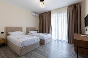 Postel nebo postele na pokoji v ubytování B Boutique Hotel