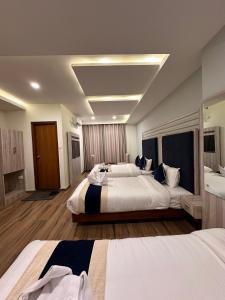 Łóżko lub łóżka w pokoju w obiekcie Hotel Adam