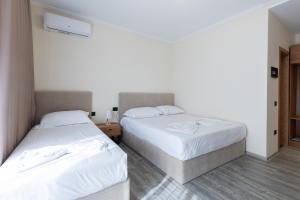 Postel nebo postele na pokoji v ubytování B Boutique Hotel