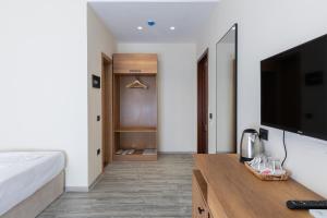 TV a/nebo společenská místnost v ubytování B Boutique Hotel