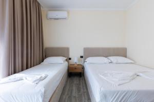 Postel nebo postele na pokoji v ubytování B Boutique Hotel
