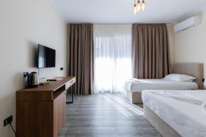 Postel nebo postele na pokoji v ubytování B Boutique Hotel