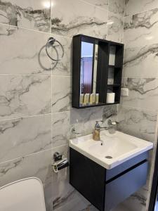 a bathroom with a sink and a mirror at RUM MAGIC SANDS BuBBLES CAMP in Wadi Rum