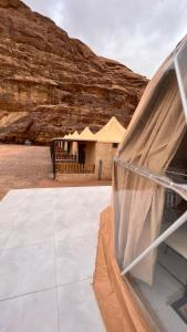 a view of a building in the desert at RUM MAGIC SANDS BuBBLES CAMP in Wadi Rum +39 photos