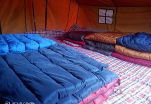 Postel nebo postele na pokoji v ubytování Balaji camping kedarnath