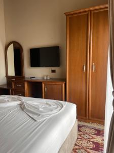 Postel nebo postele na pokoji v ubytování B Boutique Hotel