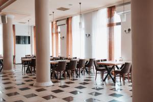 TV a/nebo společenská místnost v ubytování Hotel Neptun