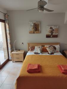 a bedroom with a bed with two pillows on it at Casa Lily in Caleta De Fuste +62 photos