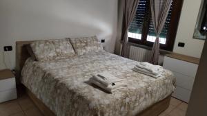 Postel nebo postele na pokoji v ubytování Apartment Artemisia - Cantù Centro