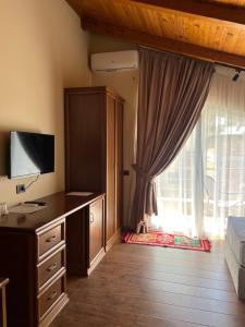 TV a/nebo společenská místnost v ubytování B Boutique Hotel