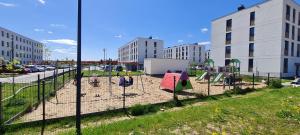 a park with a playground in the middle of a city at Apartament "Cztery Pory Roku" in Świdnik