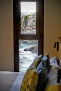 A bed or beds in a room at Hotel Casa Peix