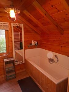 a bathroom with a large tub in a room at Innersoulhouse in Wuustwezel