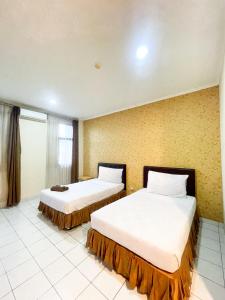 Кровать или кровати в номере Hotel Posters +10 фотографий